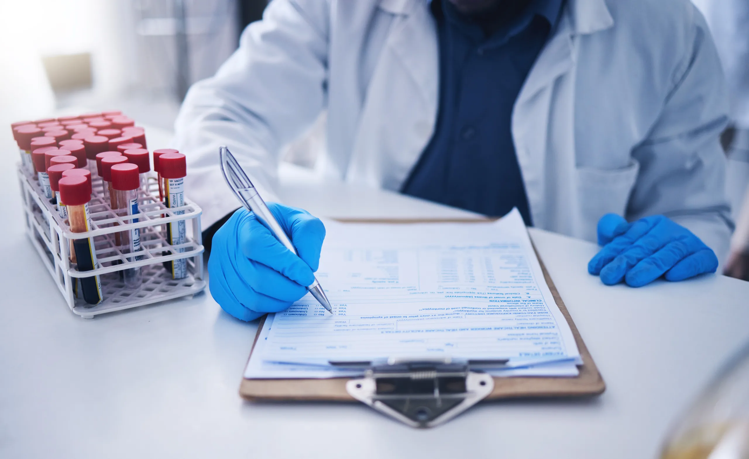blood test science documents hands laboratory healthcare results research review development scientist medicine writing medical results dna investigation paperwork report scaled