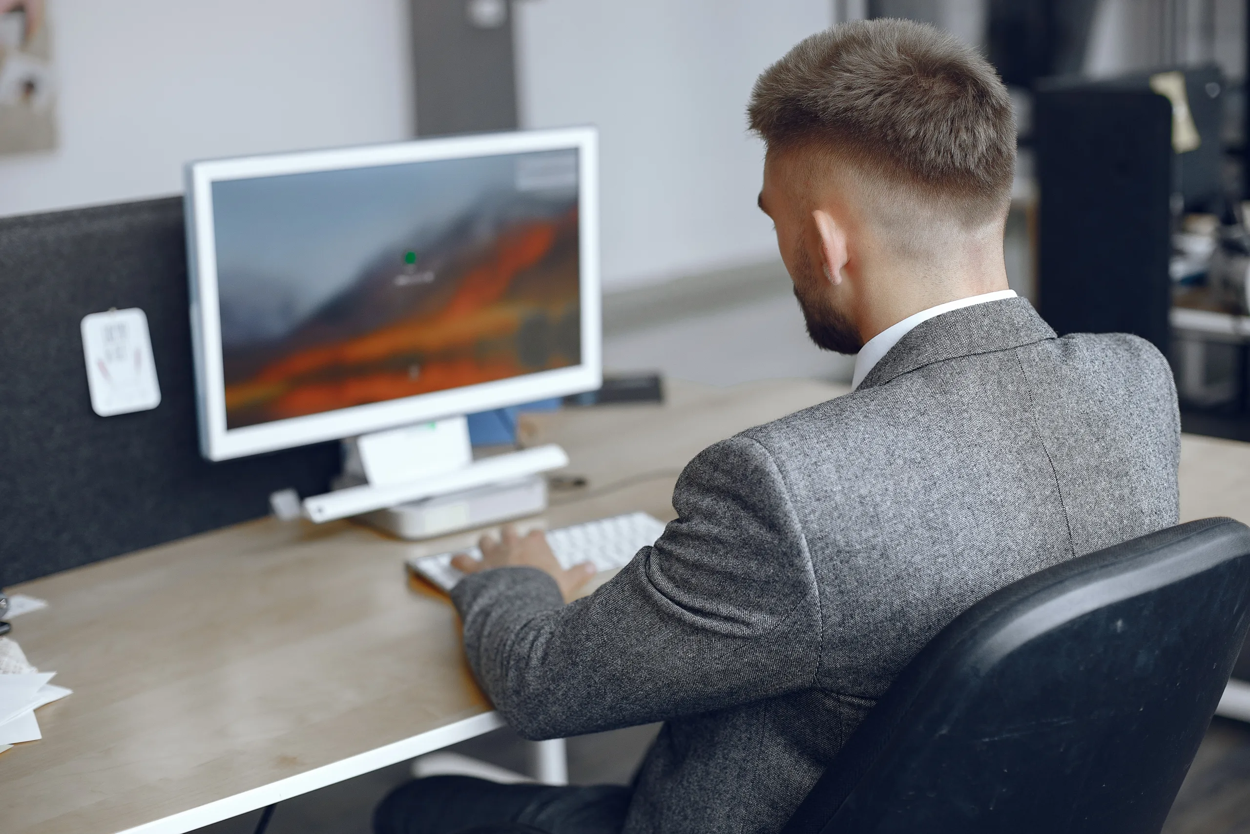 businessman working office man uses computer guy is sitting office scaled
