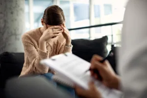 depressed woman having psychotherapy session doctor s office