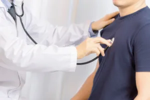 doctor examination young man with stethoscope hospital