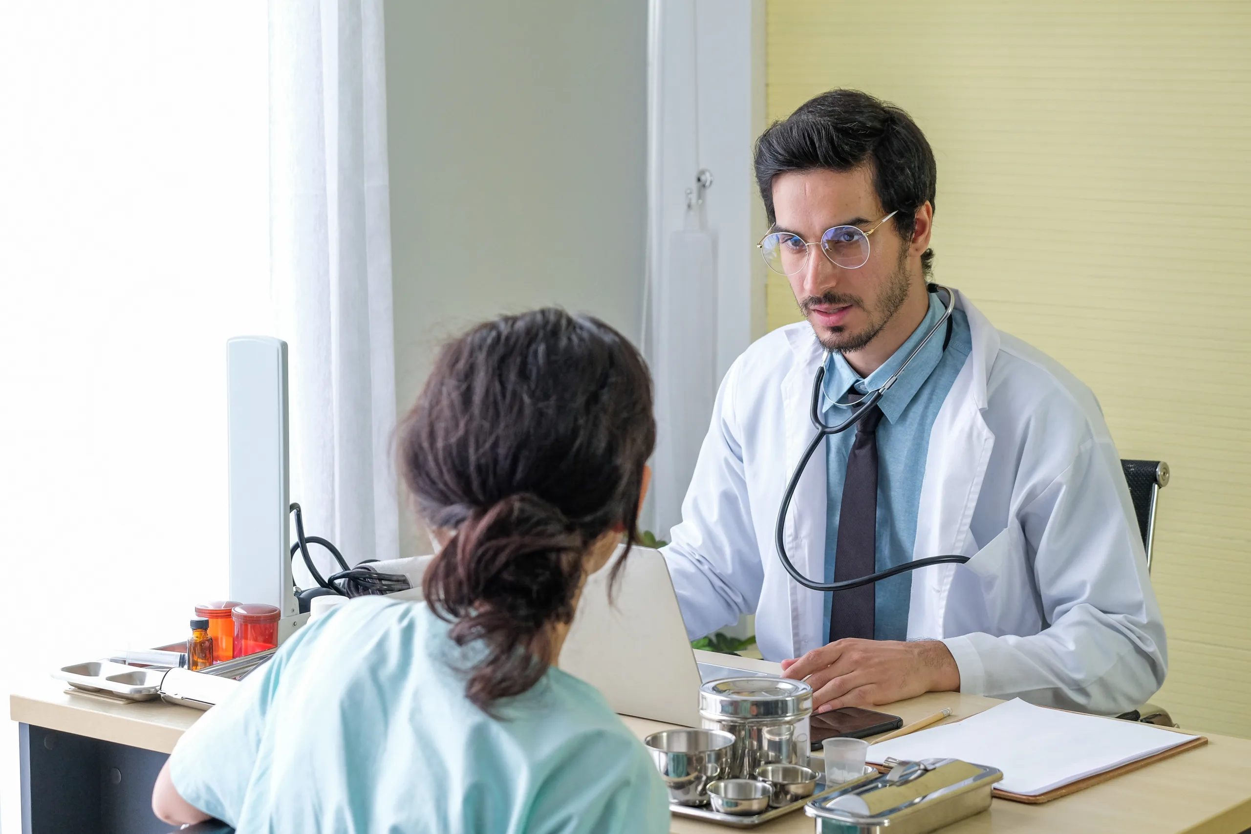 doctor talking with patient hospital scaled