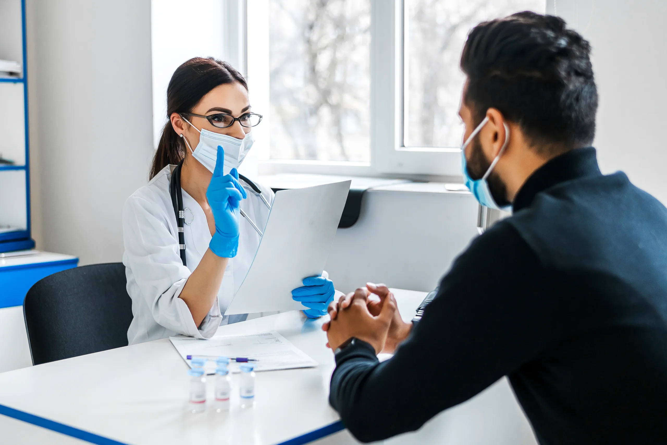 female doctor consults her patient holds documents her hands 1 scaled