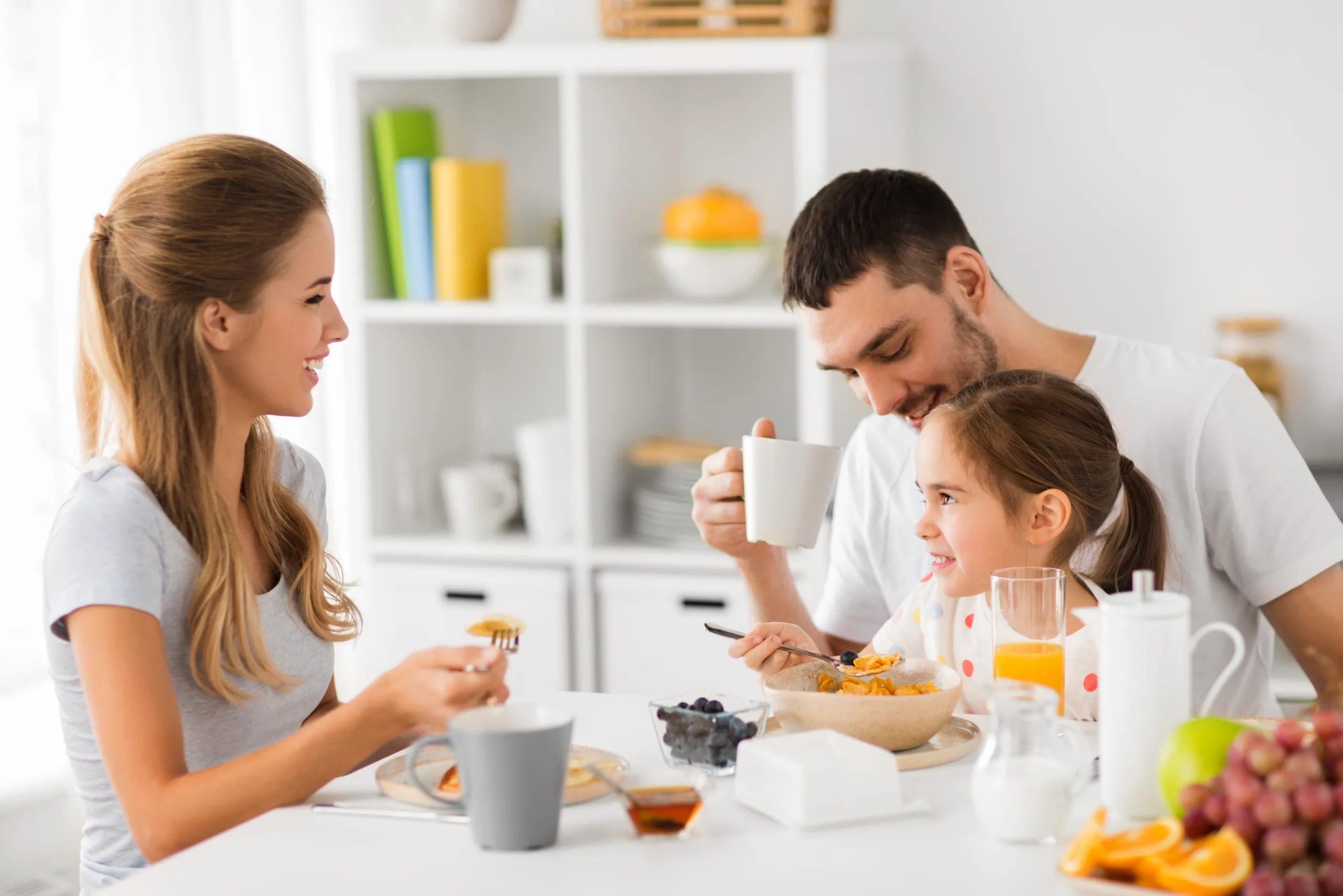 happy family having breakfast home scaled