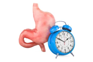 human stomach with alarm clock first aid treatment stomach concept 3d rendering