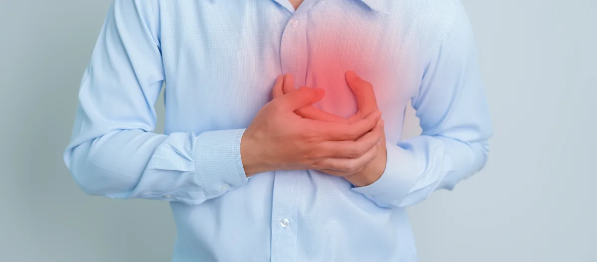 man hand holding chest ache heart disease angina disease symptom heart attack disease cardiovascular atherosclerosis hypertensive world heart day health concept