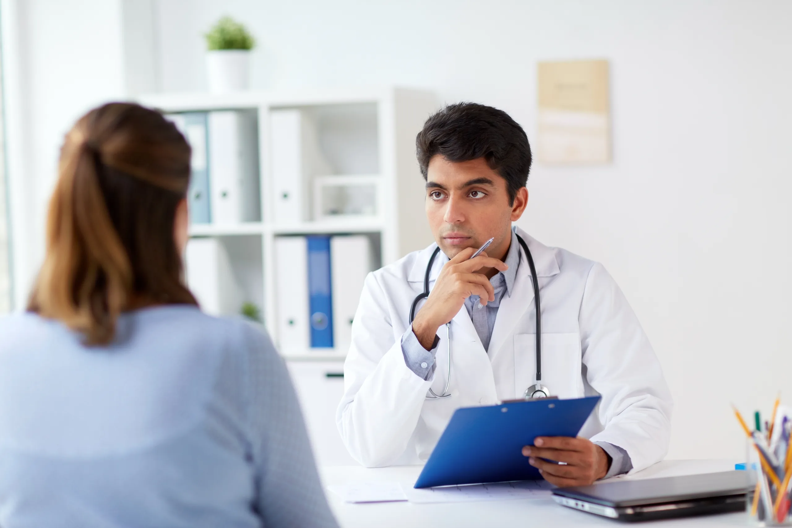 medicine healthcare people concept doctor with clipboard patient hospital scaled