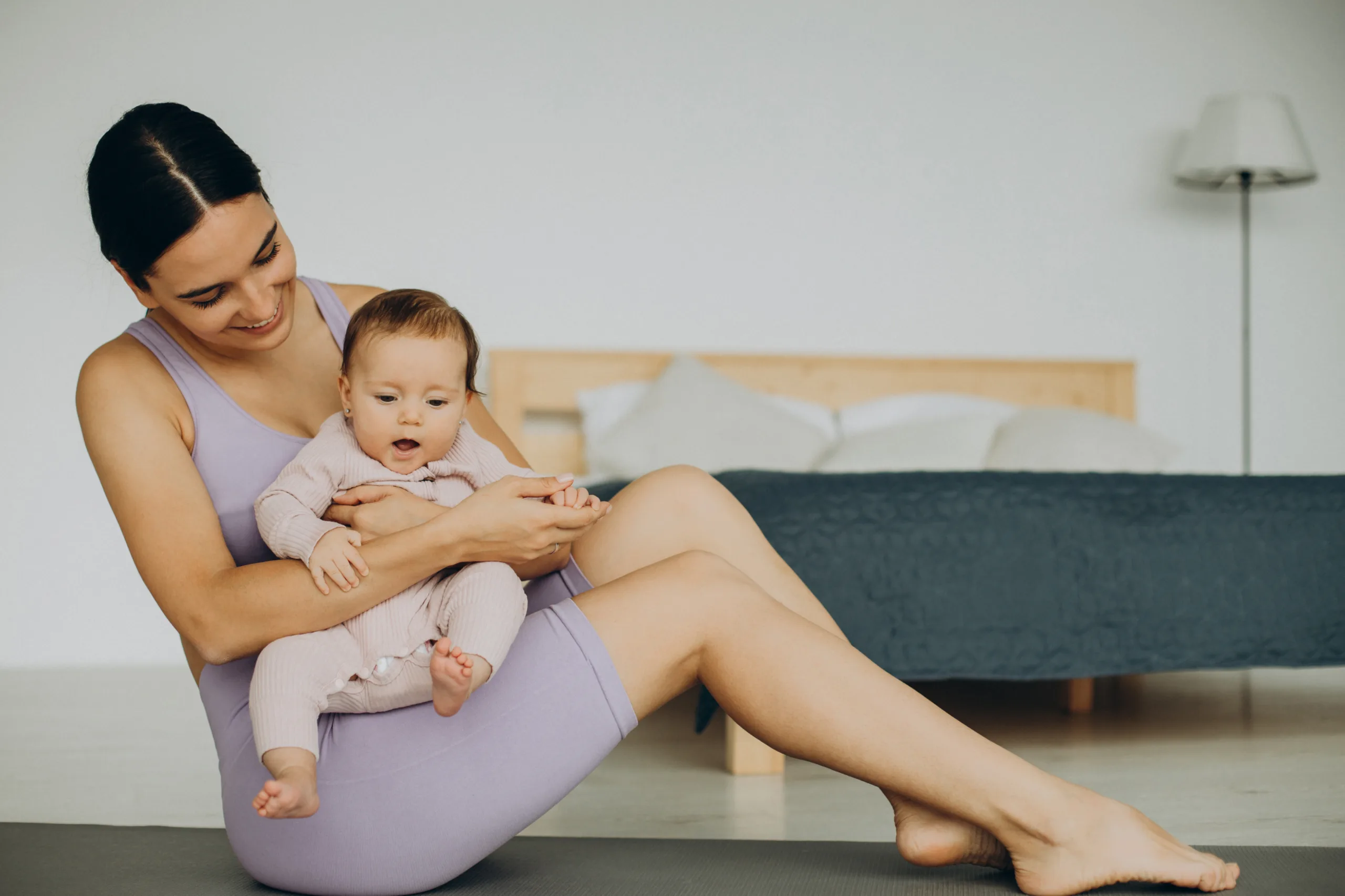 mother with her baby daughter practice yoga home 1 scaled