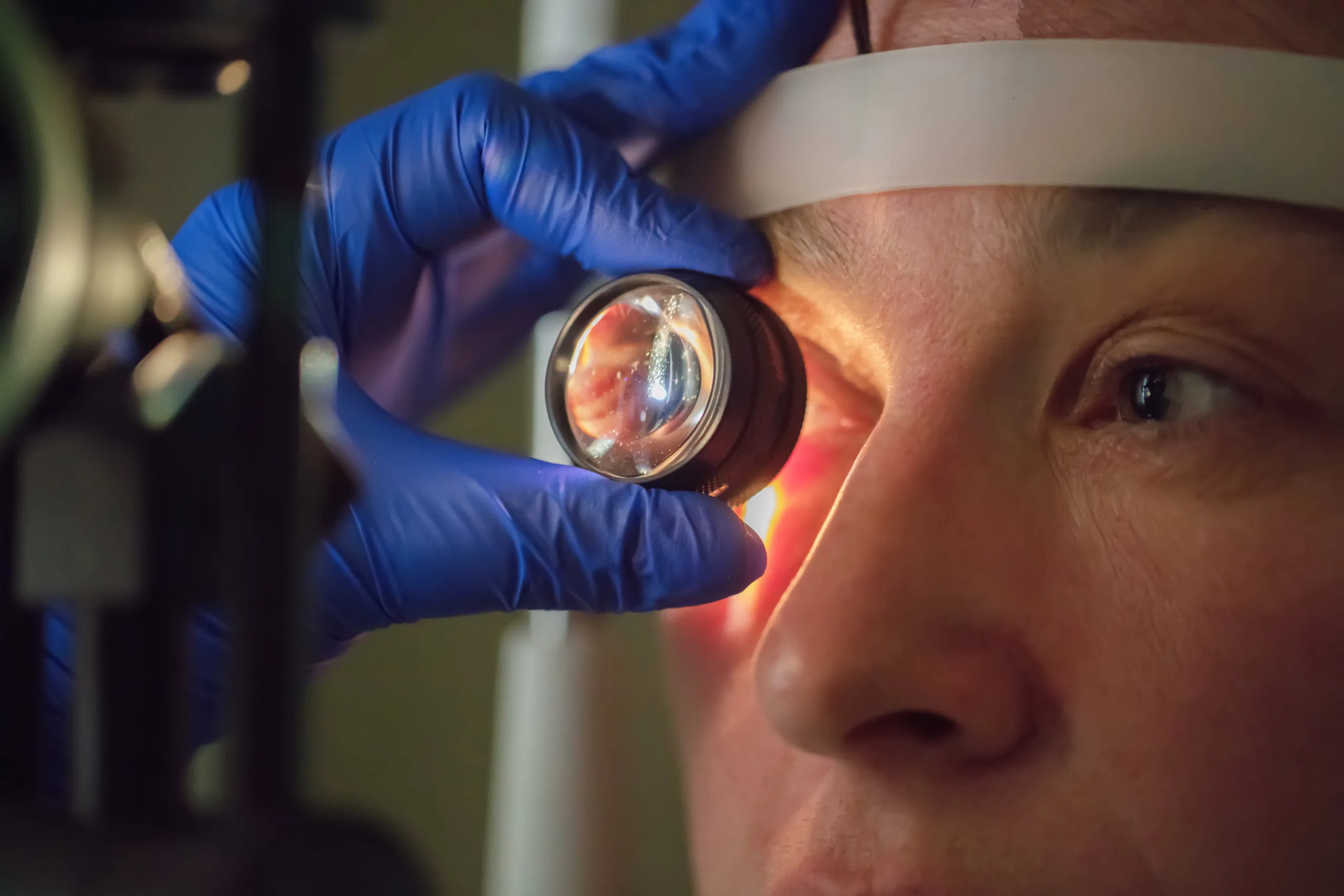 ophthalmologist checks fundus patient scaled