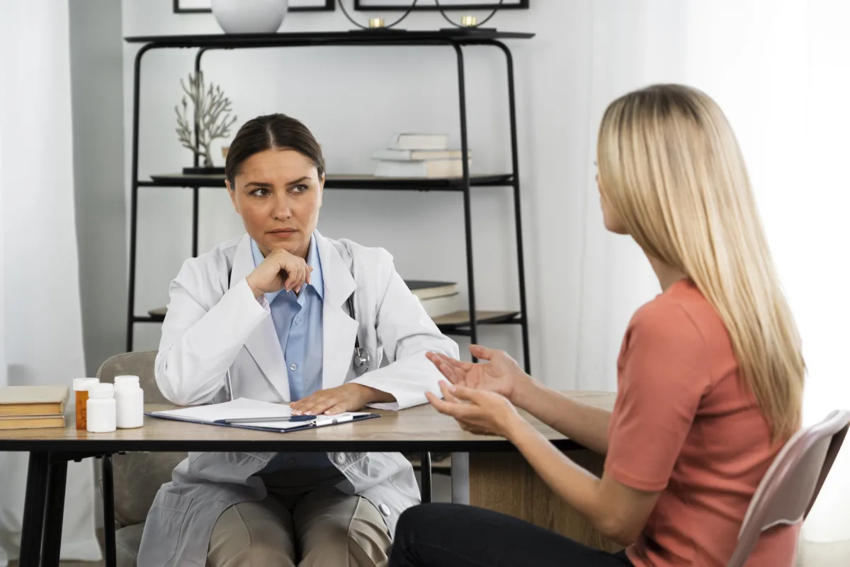 side view woman talking doctor