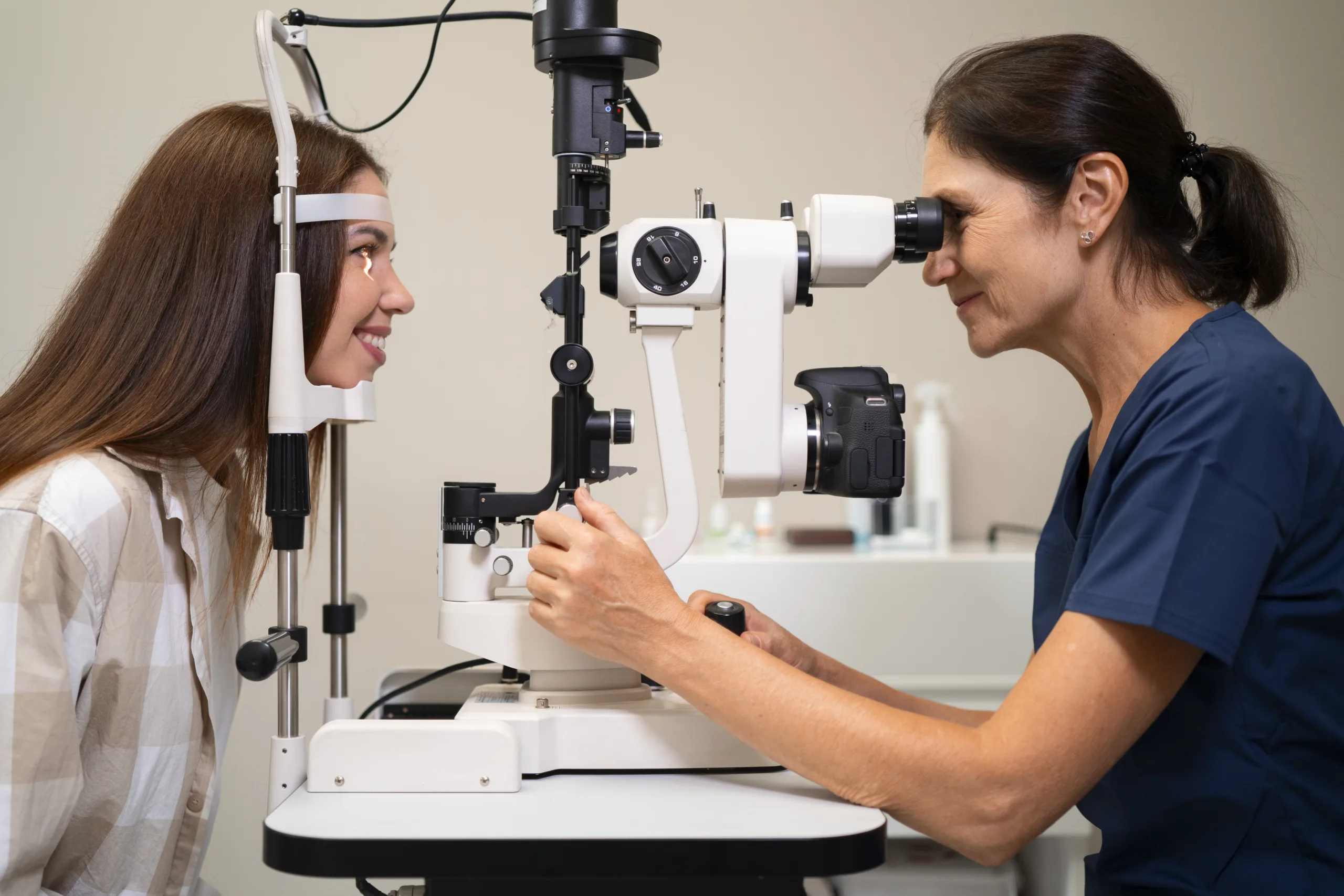 woman getting eye exam ophthalmologist office scaled