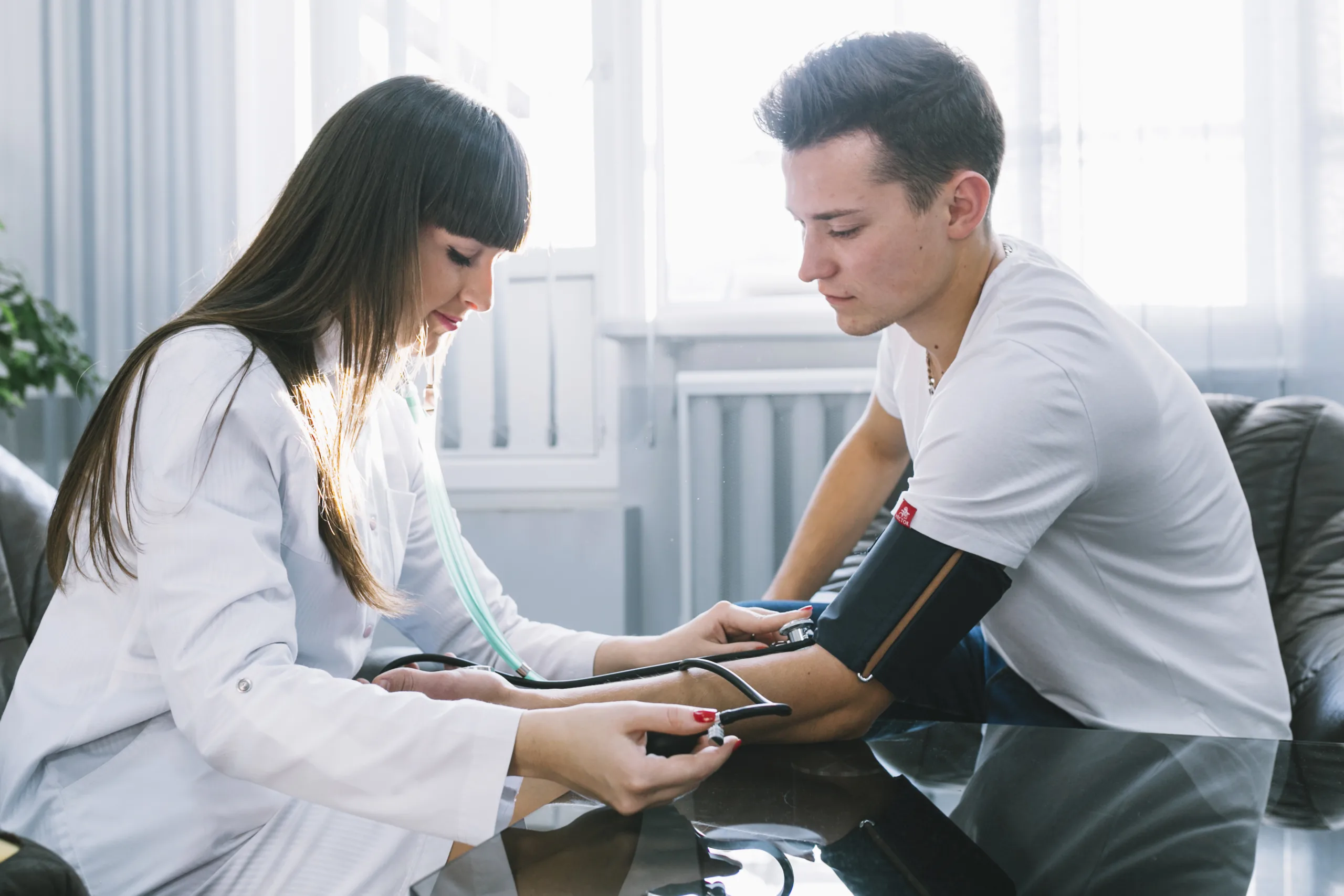 woman measuring pressure pulse patient scaled