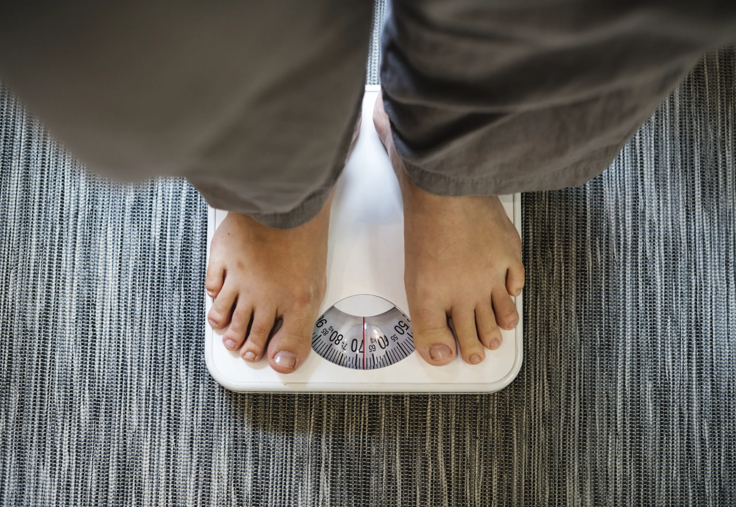 woman standing scale scaled